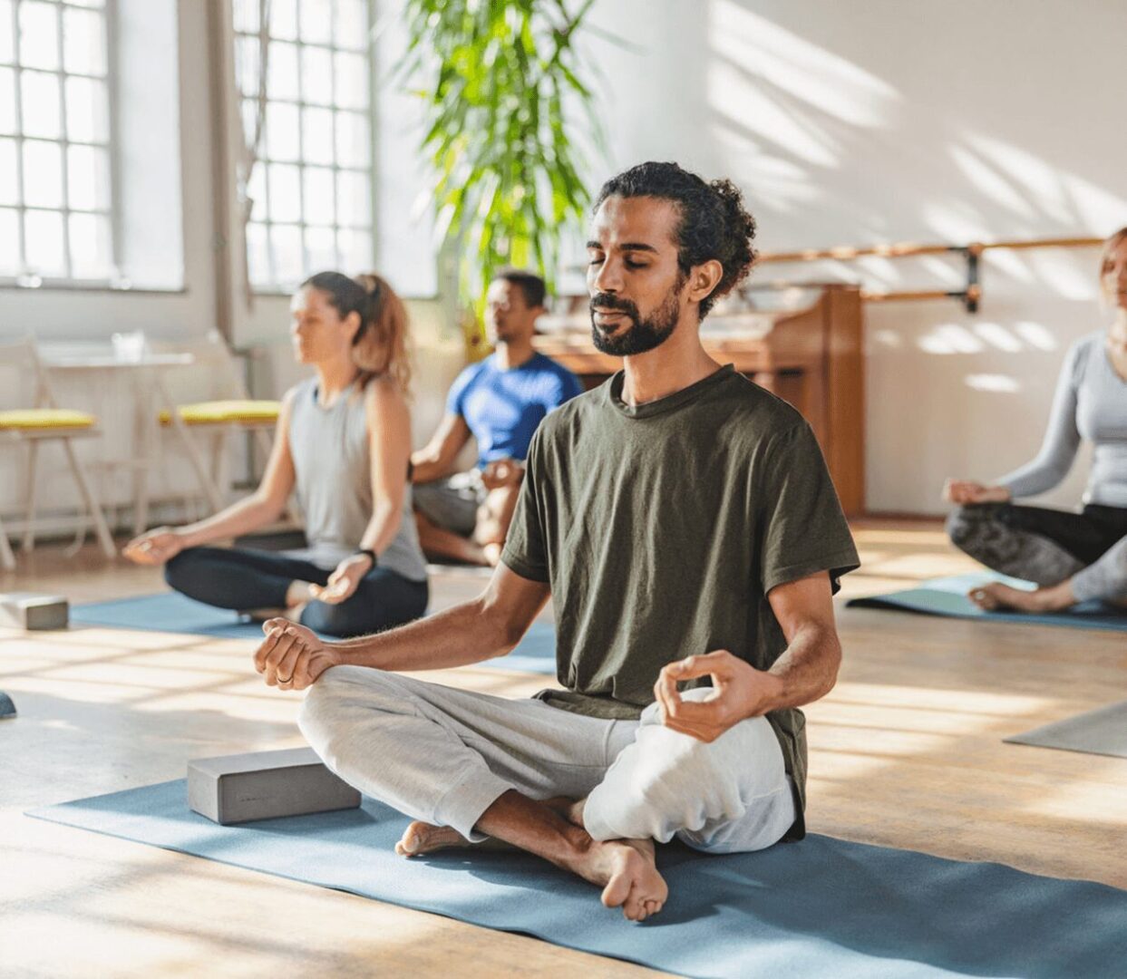 People meditating in a yoga class.