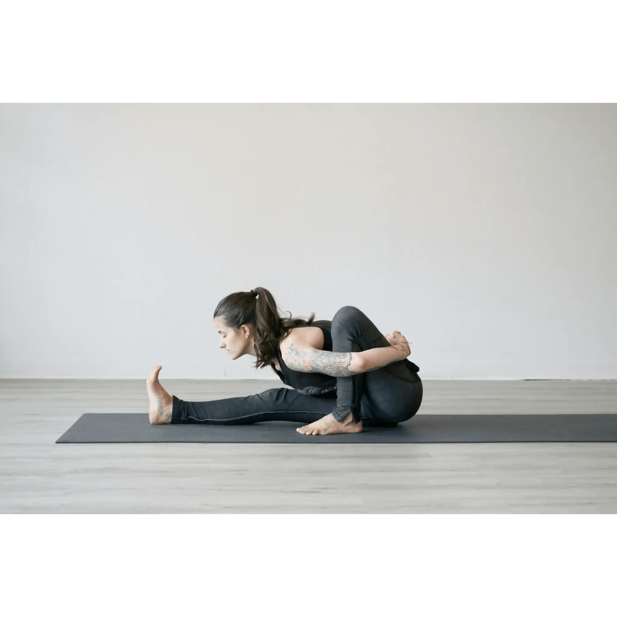 Woman practicing yoga on a mat.