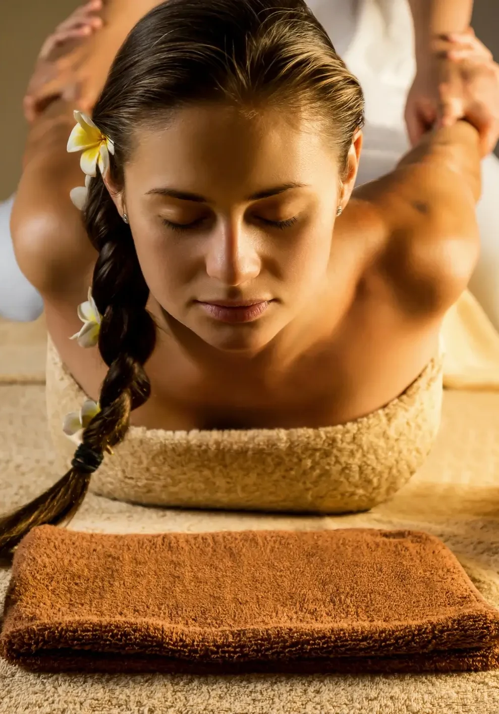 Woman receiving a relaxing shoulder massage at a spa.
